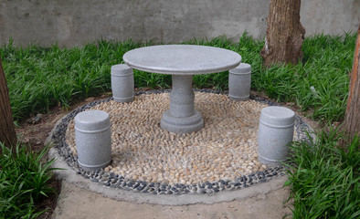 Set stone table and benches in the garden