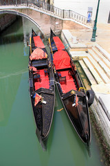 Fototapeta na wymiar Venice Narrow Canal and Two Moored Gondolas