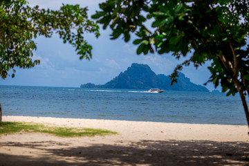 Noppharat Thara Beach- Krabi, the background of the fishing boats of the villagers docked in the midst of the blue sea, is a beautiful tourist destination in southern Thailand.