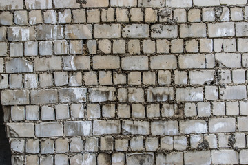 Background concrete wall, traces of weathering, worn wall damaged paint old paint. Remains of old paint on the painted concrete surface. Grungy destruction surface.