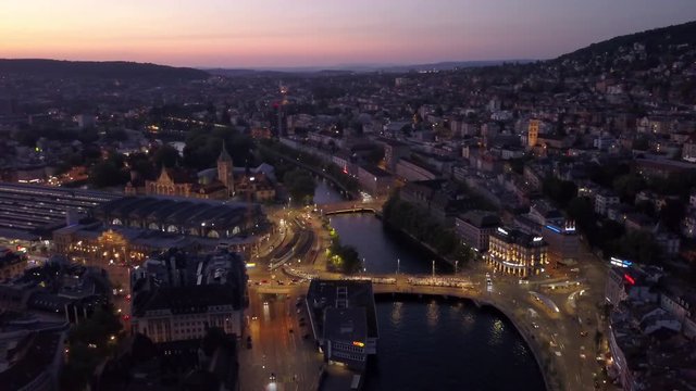 sunset illuminated zurich city center riverside aerial panorama 4k switzerland
