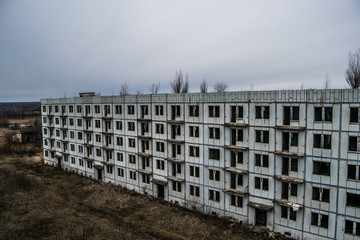 Old destroyed an abandoned multi-storey building in a military t