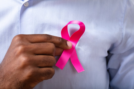 Close-up Of A Man's Hand With Pink Ribbon