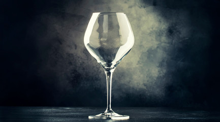 Empty wine glass for red wine, gray background, selective focus
