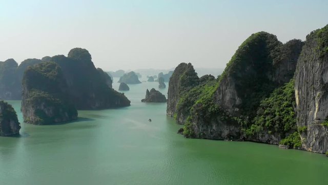 Unique aerial footage of Ha Long Bay, a UNESCO world heritage site. Thousands of limestone karsts and isles create one of the most breathtaking landscapes on earth. Time lapse 4x normal speed.