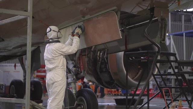 Repair of the aircraft fuselage. The color of the fuselage of the aircraft alyet. The plane goes to the hangar for repairs. The broken wing of the plane. The plane after the accident on the repair. 4k