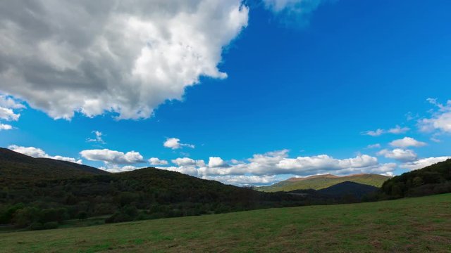 4k time lapse with beautiful Bieszczady mountains under blue sky with clouds. Filmed near Wolosate village.