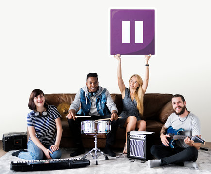 Band of musicians holding a pause button icon