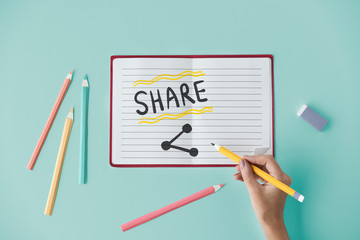 Hand writing Share on a notebook