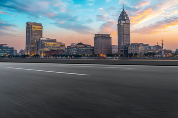 Obraz premium City skyscrapers and road asphalt pavement