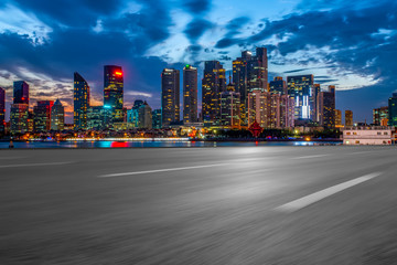 Fototapeta premium City skyscrapers and road asphalt pavement