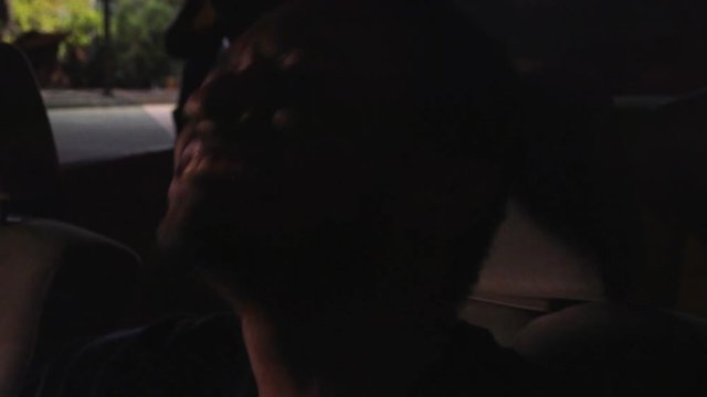 Black Man Jams Out To Music In Parked Car, Close Up