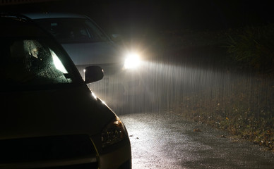 Heavy rain under headlight of vehicle at night