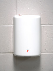 air blower hand dryer on the wall in bathroom
