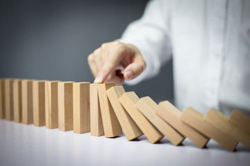 Problem Solving Businessman Stopping Falling Blocks