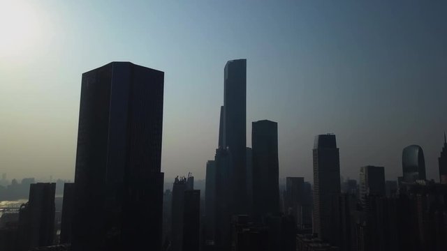 Aerial shot of mega city Guangzhou Central building district (CBD) with skyscrapers on a sunny day in the afternoon