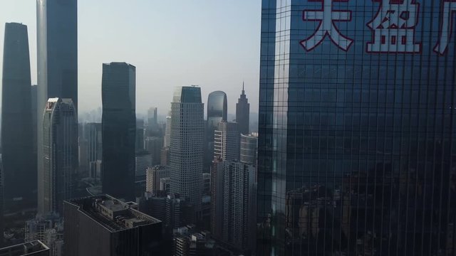 Aerial shot of mega city Guangzhou Central building district (CBD) on a sunny day in the afternoon