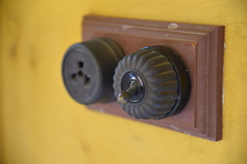 Vintage put light switch on wall. Ancient power switch.