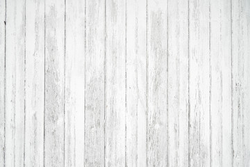 Old weathered wood surface with long vertical boards. Wooden planks on a wall or floor with grain and texture. Light neutral flat faded tones.