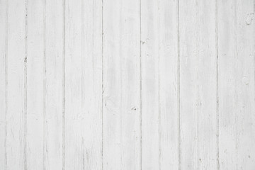 Old weathered wood surface with long vertical boards. Wooden planks on a wall or floor with grain and texture. Light neutral flat faded tones.