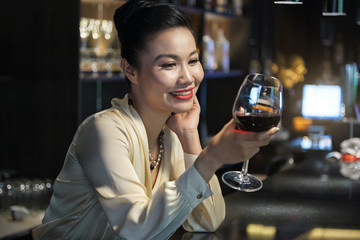 Beauiful woman drinking wine