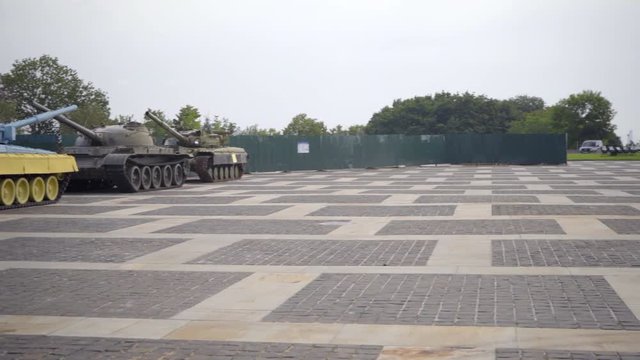 View of two Russian tanks vs one tank in Ukrainian colors