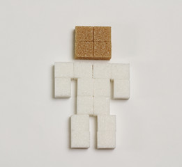 Conceptual human body made by sugar cubes