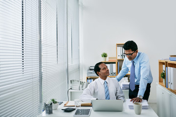 Colleagues discussing work