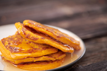 pancake with honey on wooden background