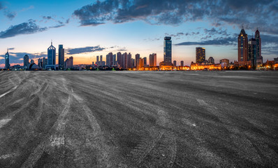 City skyscrapers and road asphalt pavement