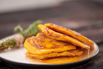 pancake with honey on wooden background