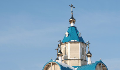 Fototapeta na wymiar Domes of Orthodox Church on background of blue sky.