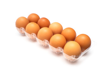 Chicken eggs in plastic package on white background.