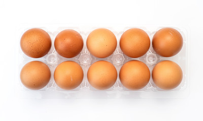 Chicken eggs in plastic package on white background.