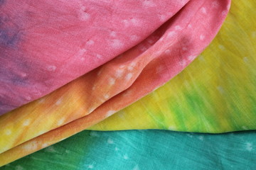 Rainbow Coloured Tie Dyed Fabric Background with Soft Focus