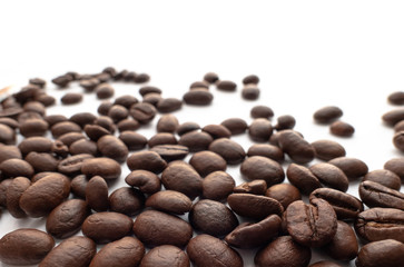 Roasted coffee beans on white background.