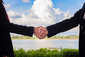 Business team to Shake hands to do business together