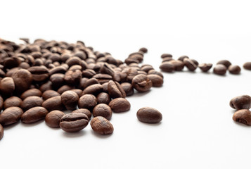 Roasted coffee beans on white background.