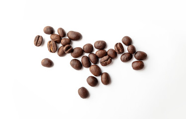 Roasted coffee beans on white background.