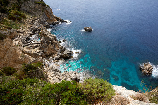 Beautiful seascape with turquoise water, cliffs and the sea. Sunny warm tropical day. Background for travel on the Mediterranean. Greece. Europe © Sergei Malkov