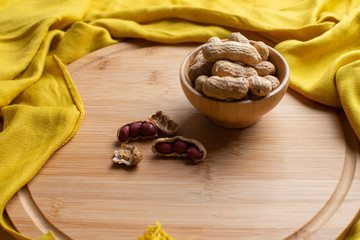 Walnuts kernels on dark desk with color background, Whole walnut in wood vintage bowl, Nuts in bamboo wooden bowl, walnuts in wood bamboo bowl