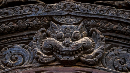 Wood carvings of Hindu Gods on the temple in Bhaktapur Durbar Square