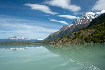 Mountains reflected in a glacial lake in Torres del Paine National Park, Chile, South America