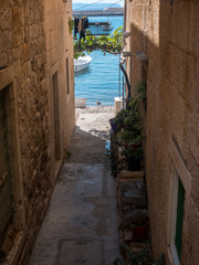 Passage between stone houses on island Vis