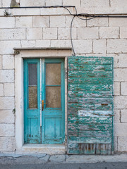 Old wooden door on stone house
