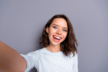 Fototapeta premium Lady blogger with her brunette hair she take picture on cellular