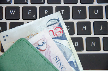 Banknotes on a black keyboard