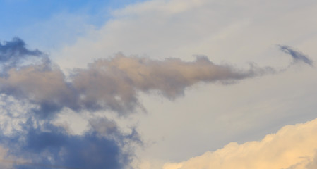 Clouds after rain before sunset as a background