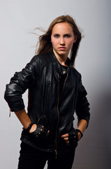 Naklejka premium beautiful girl in leather jacket