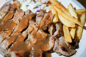 Steak and french fried food street by foodtruck, Bangkok, Thailand.
